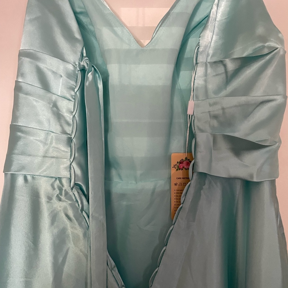 Very pretty NWT ball gown.  Never worn.  Very pretty dusty green/aqua color.
